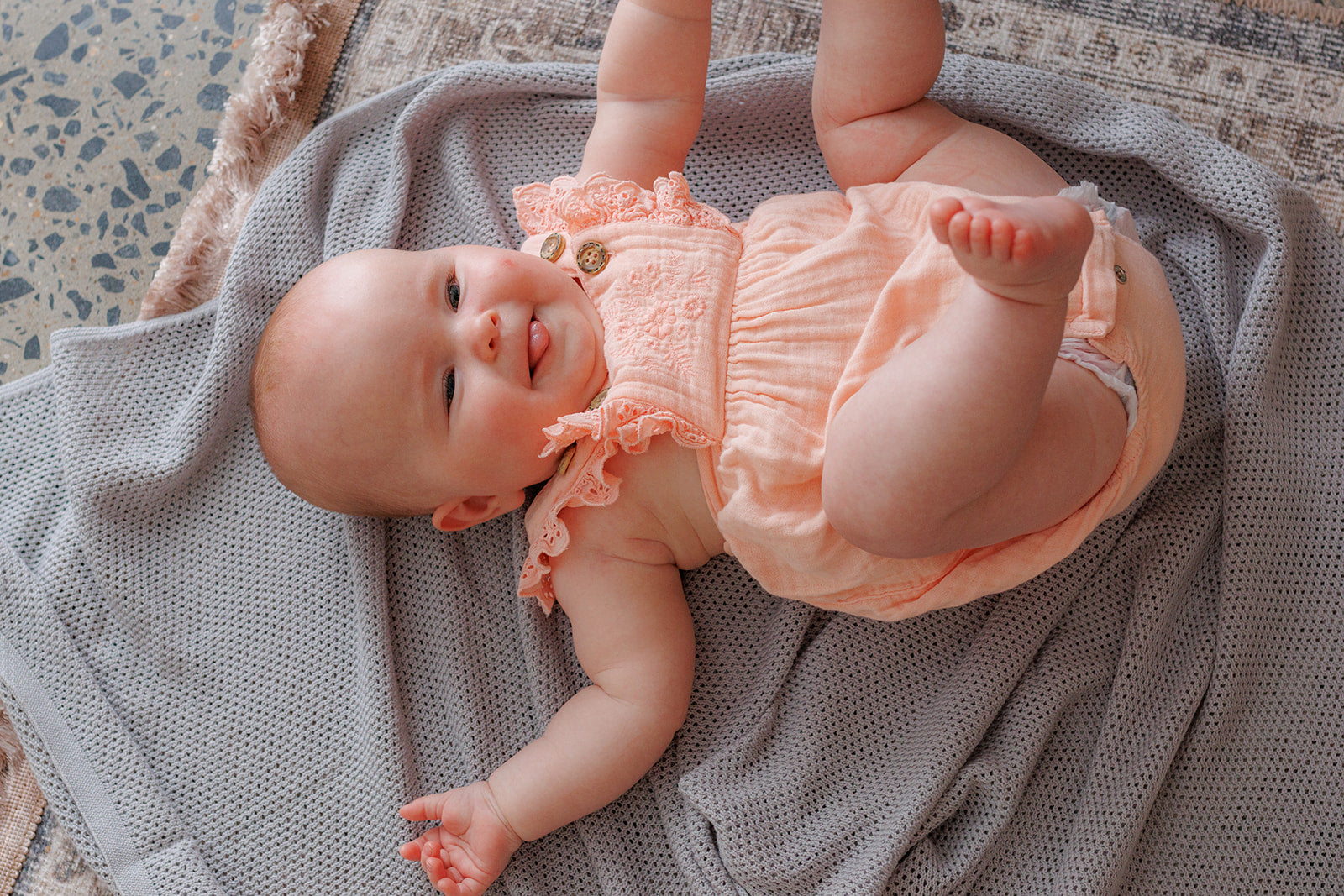 Dove grey cowrie breastfeeding cover as a baby blanket